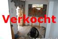 woonkamer met open keuken op de begane grond