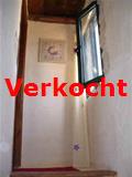 boven aan de trap op de eerste verdieping